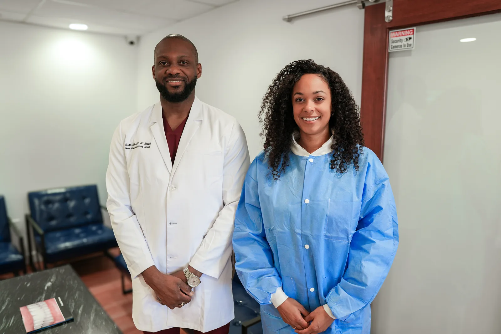 Dr. Ntekim and a dental assistant at the Seren Advanced Dentistry Oxnard front desk